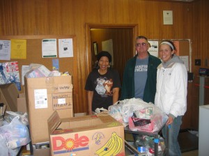 SAAC Co-Chair Kristen Traband \'08 (left) delivers perished goods to Bernardine Center