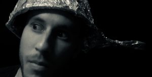 crazed person wearing tin foil hat