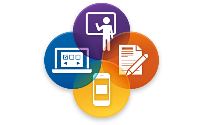 4 different color circles touching. Inside each circle is a different icon. One is a icon of a person at a chalkboard, the next is an icon of a pen and paper, the next is a mobile phone, and the last is a laptop.