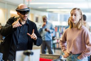 two people use an augmented reality visor