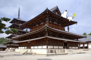 snoopy reclines on a temple