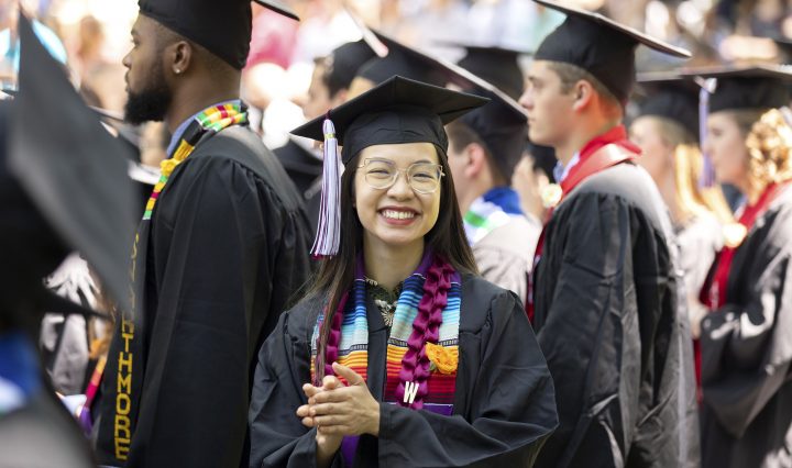 Student facing the camera during commencement on the campus on Swarthmore College campus