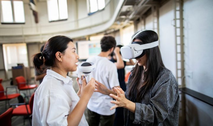 Two students using a virtual reality headset