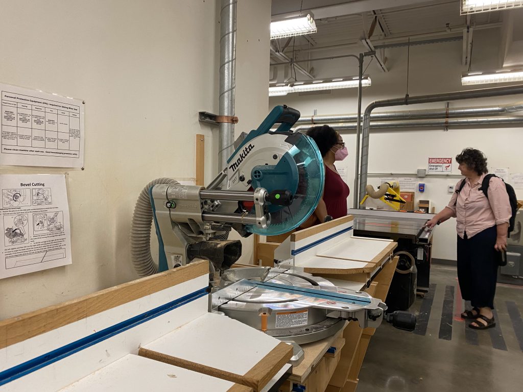 Accessibility team members look around the Wood Shop located in Tyler School of Art and Architecture.