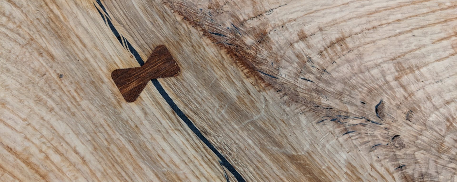 close up of finished hardwood with inlay