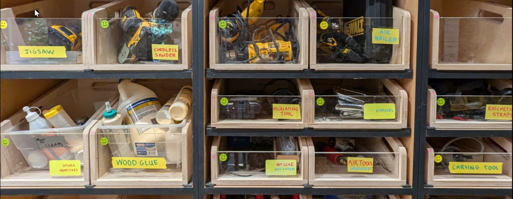 a close up of organized tool bins with tags and labels