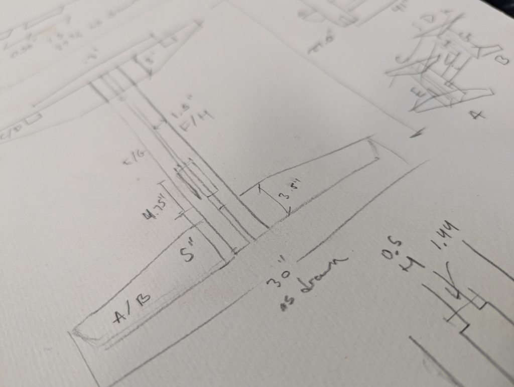 a pencil sketch of elevations of a piece of furniture, vaguely japanese mid-century style.