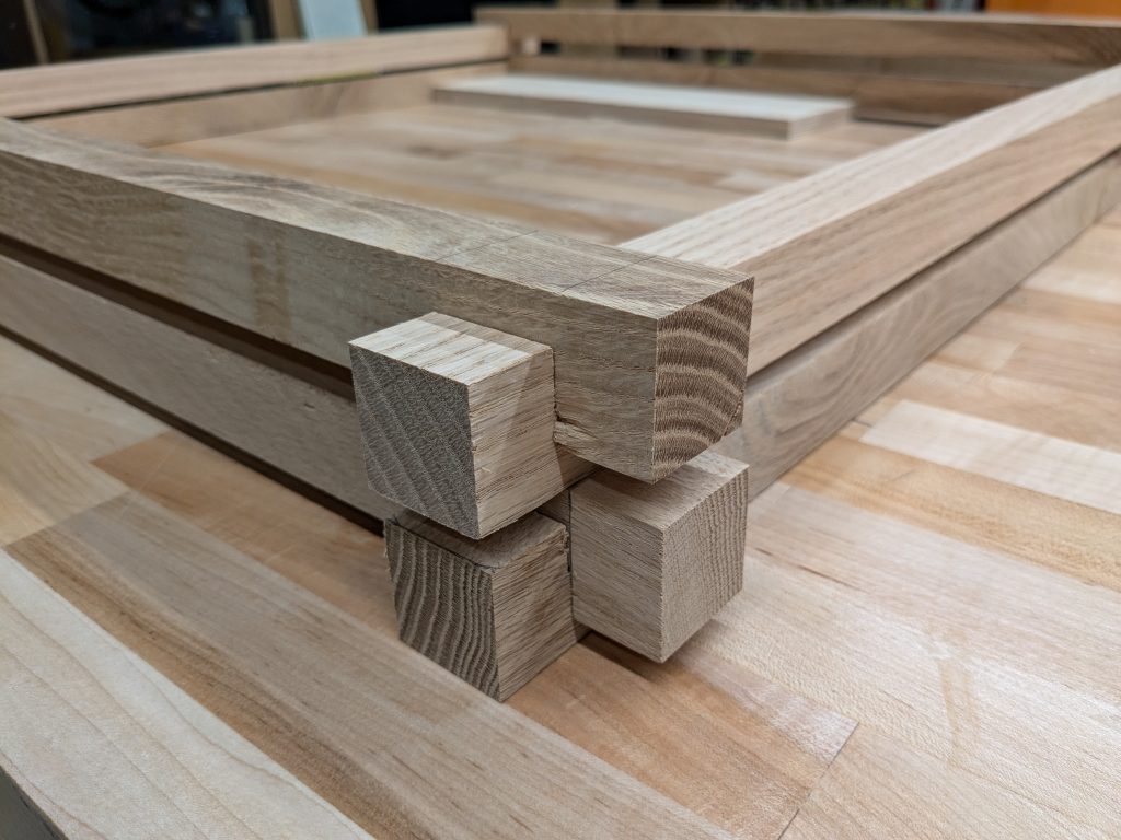 closeup of a corner joint in square oak rods