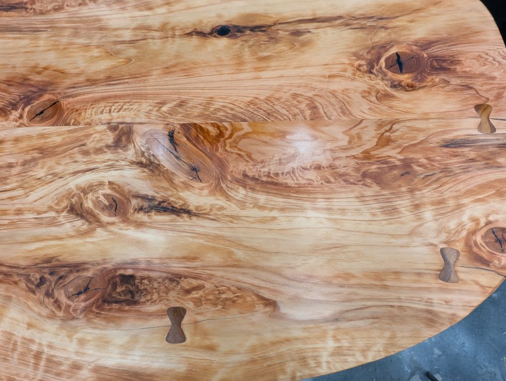 close up, full-frame view of the highly detailed surface of finished redwood, with wood grain and other fabrication additions