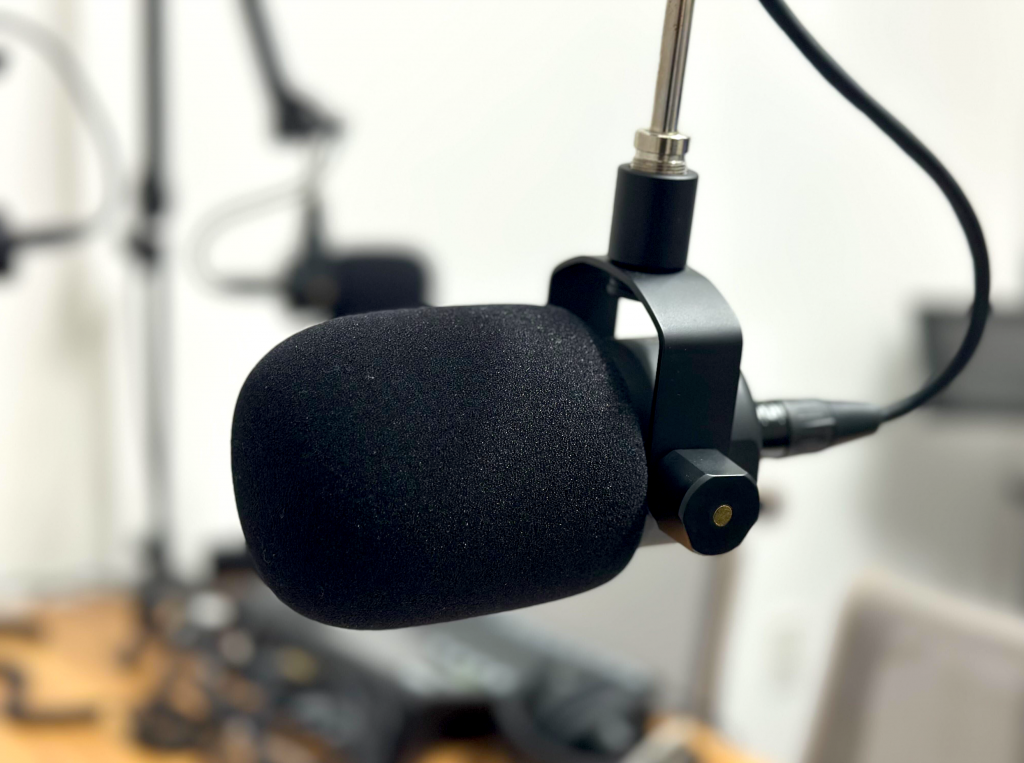 A microphone with a windscreen cover