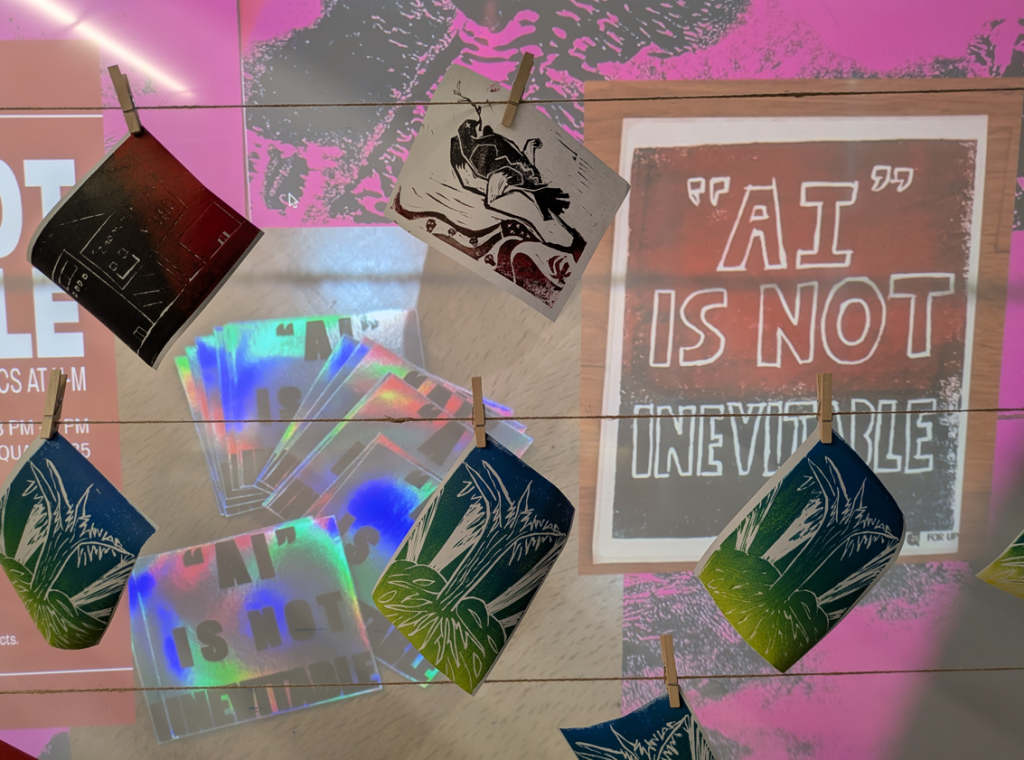 a closeup of art prints hung up on clothespins in front of a projected graphic