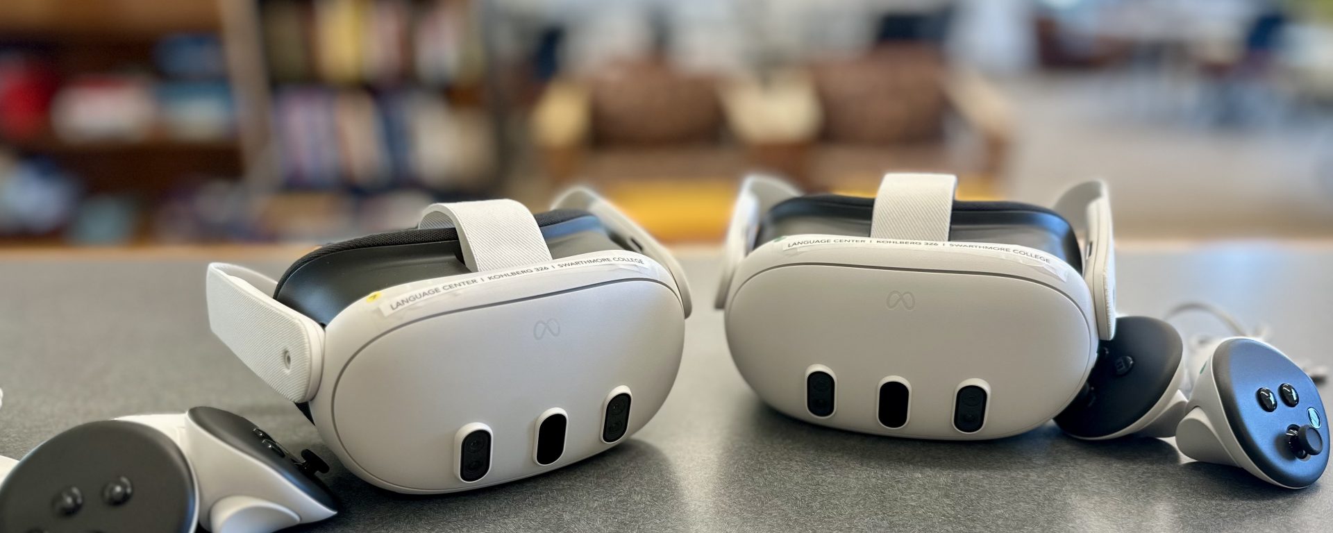 2 Meta Quest 3 headsets and 2 handsets sitting on a table in the Language Center