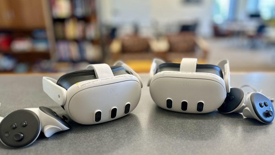 2 Meta Quest 3 headsets and 2 handsets sitting on a table in the Language Center